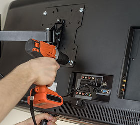Man hands installing mount TV on the wall.jpg