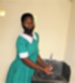 Girl in the new washroom built at Likulu Primary School