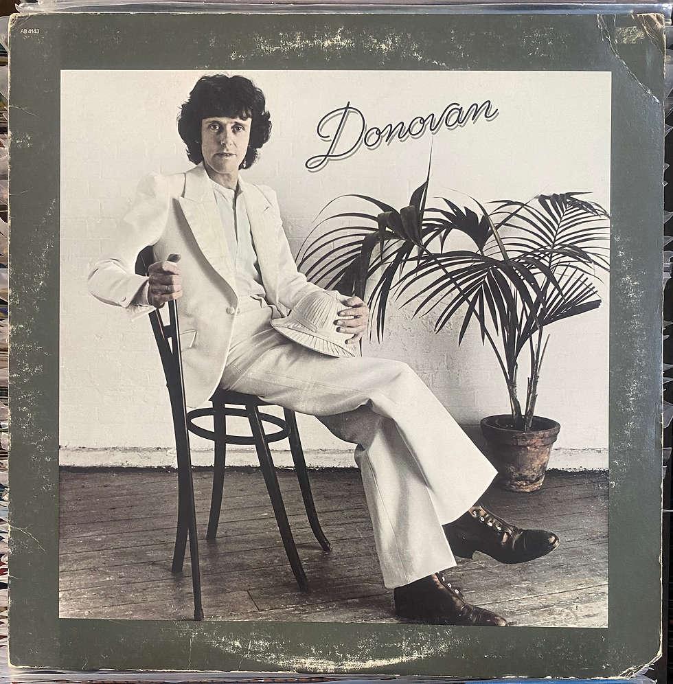 Donovan: copertina album, cantante seduto, elegante