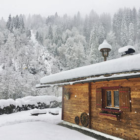 Traditional Austrian holiday hut in the snow