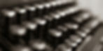 Close-up of vintage typewriter keys in sepia tone, letters and numbers visible, creating a nostalgic and timeless feel.