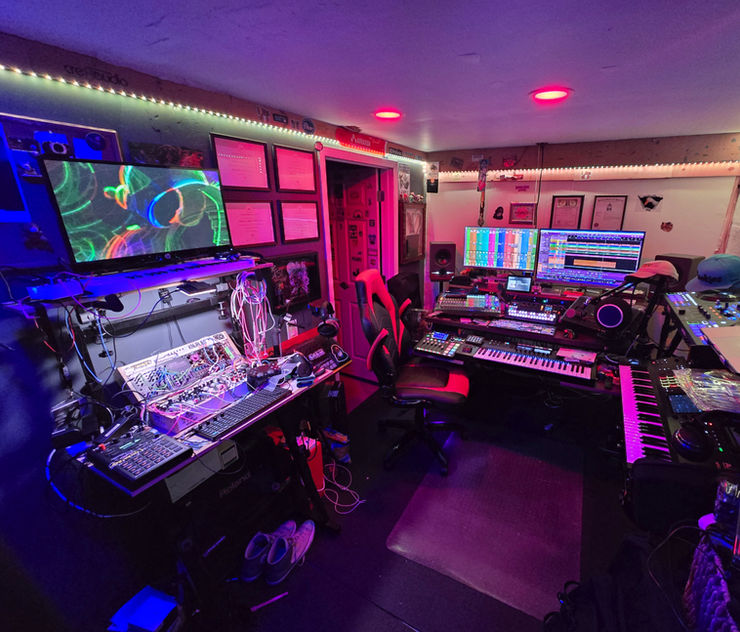 A vintage analog music studio setup with synthesizers and warm studio lighting for a creative atmosphere