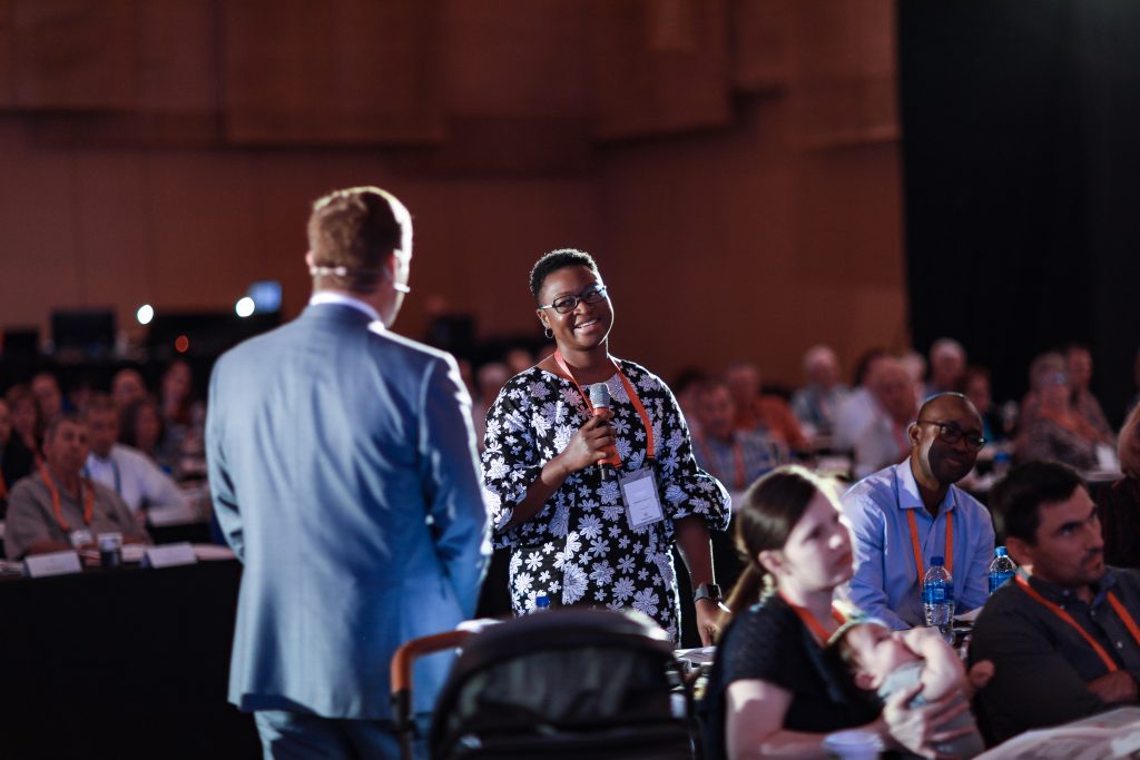 A participant speaking with Mark Matson at the American Dream Experience