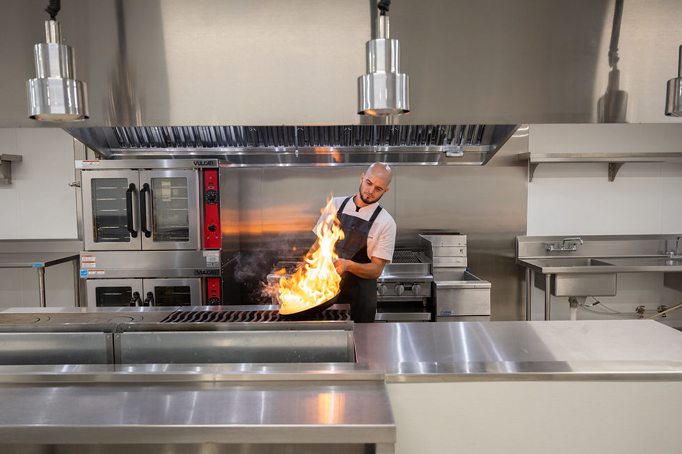Chef Brian Garcia flambeing at Sanctuary MiMo's commercial kitchen