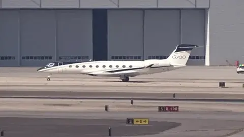 G700 on a runway in front of a hangar
