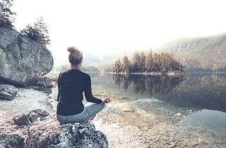 A woman meditating in nature