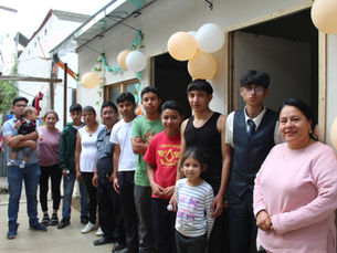 Family in front of the new house