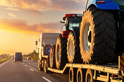 POV heavy industrial truck semi trailer flatbed platform transport two big modern farming