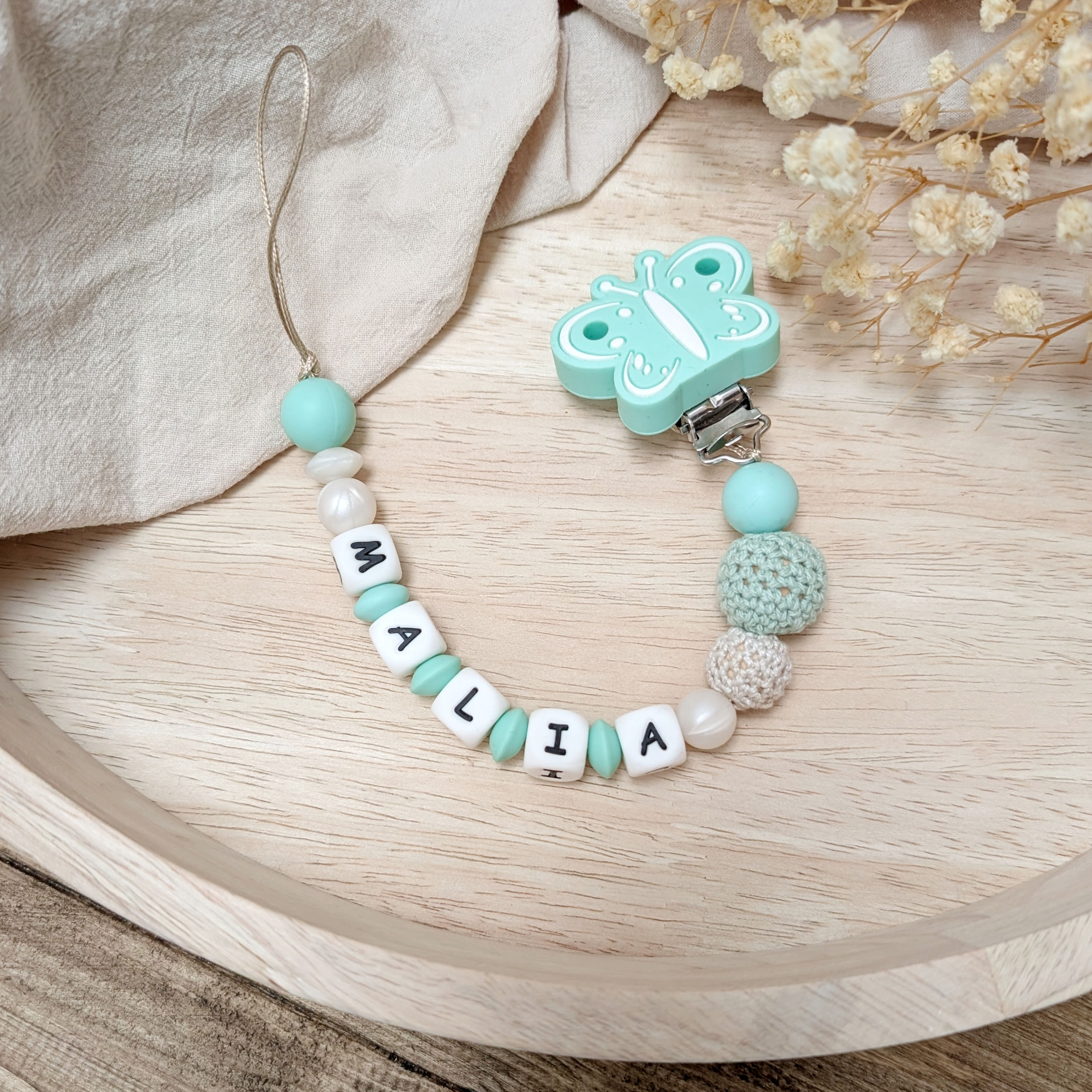 Nuggikette / Schnullerkette "mintfarbener Schmetterling"