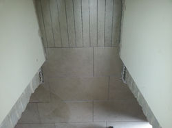 Floor tiling - strips cut out of main floor tiles!