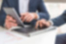 close-up-businessman-discussing-financial-report-digital-tablet.jpg