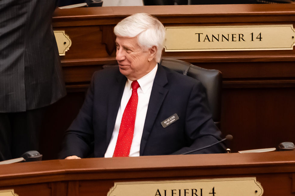 Rep. Joe Alfieri sitting during a House floor recess.