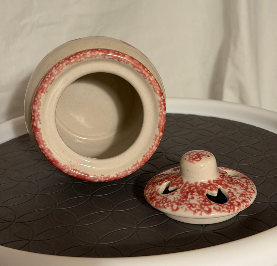 Vintage Red Heart Potpourri Pot, 4.5" H, a bulbous shape, heart shaped pierced vents, cream base, red spatterware pattern.