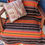Thumbnail: Biker Bed Roll tote wrap with Isla brown serape mexican blanket