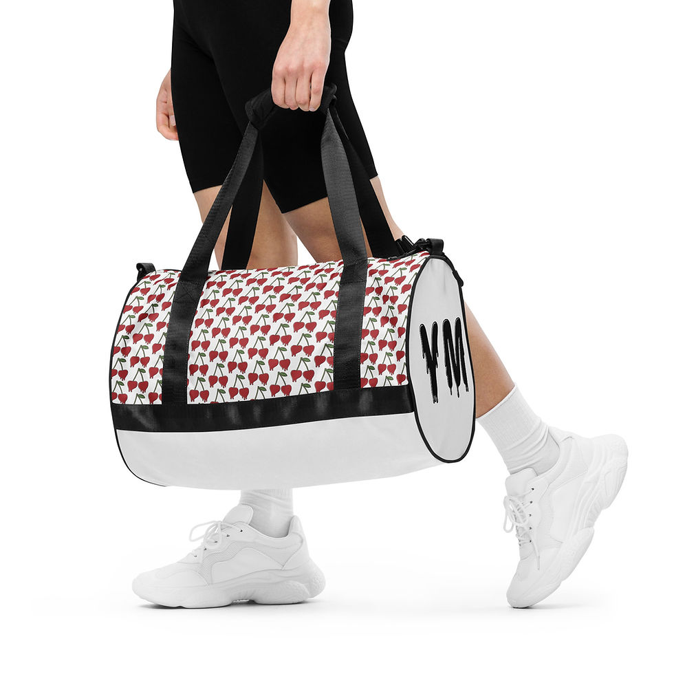 Thumbnail: Person carrying YM monogrammed duffel bag