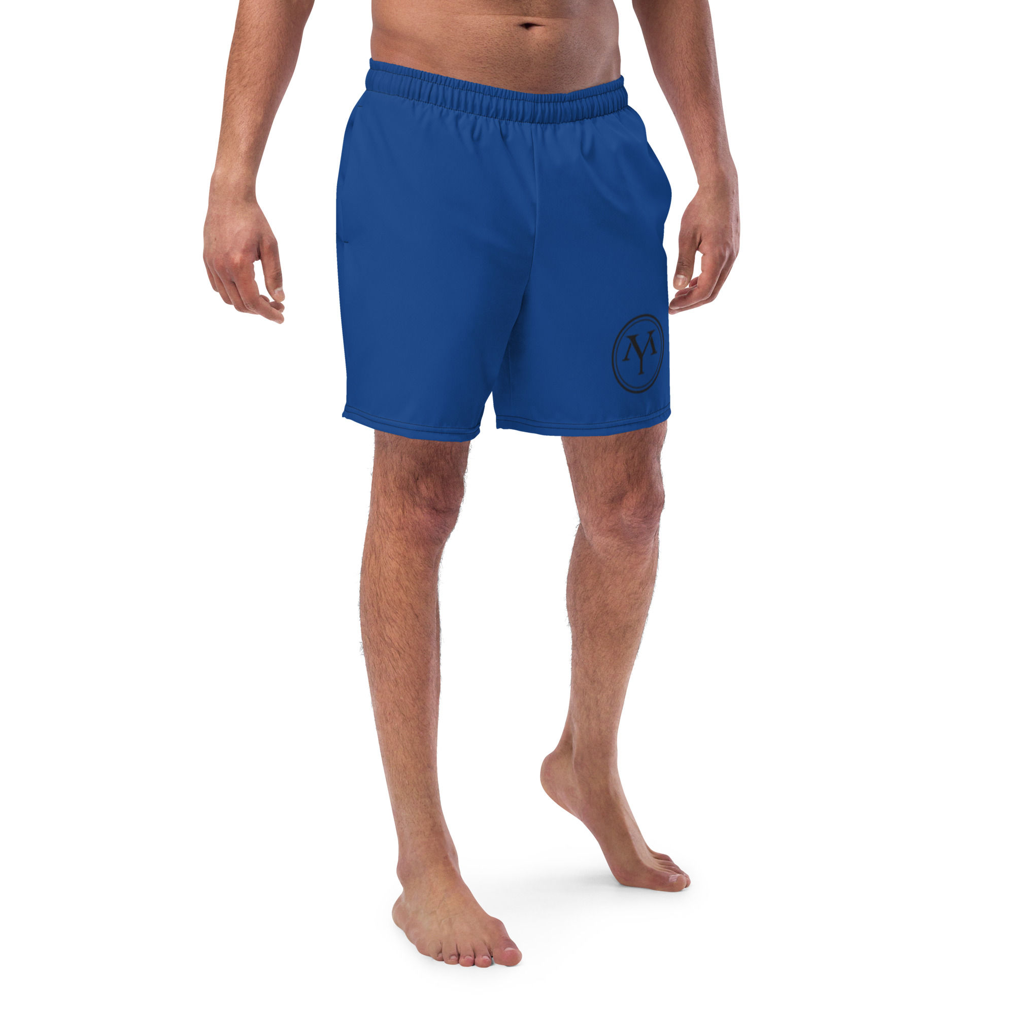 Man modeling royal blue YM Drip Letter Track Pants