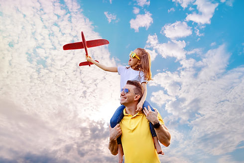 happy-father-daughter-playing-with-plane.jpg