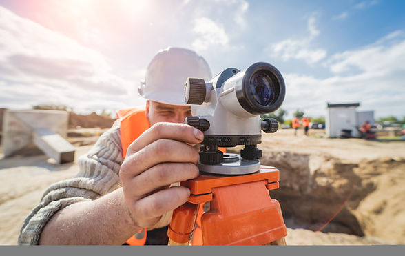 surveyor-worker-with-theodolite-equipment-construction-site.jpg