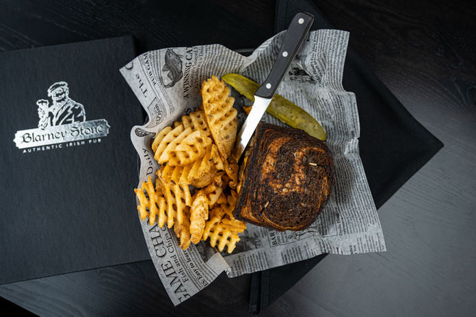 Patty O'Reilly: Burger with Swiss cheese, American cheese, grilled onions, and 1000 island dressing. Served on grilled marbled rye