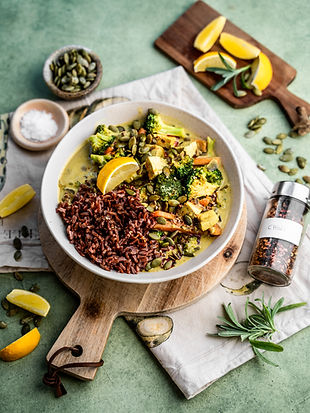Yellow curry with tofu, broccoli and wild rice in a bowl