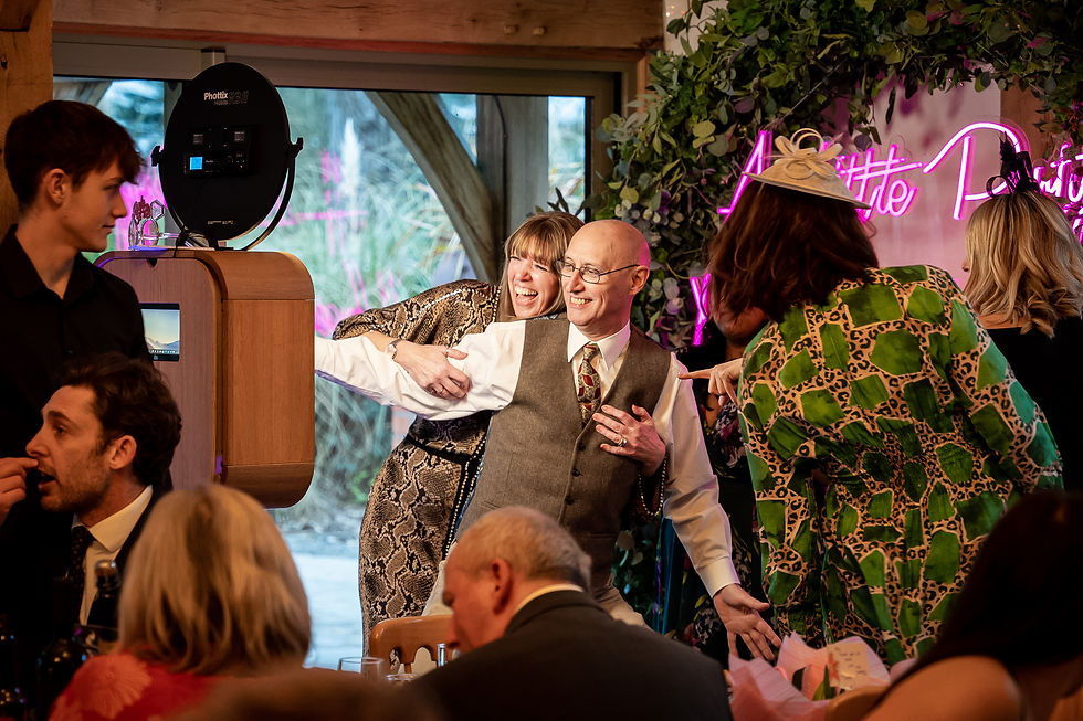 Couple enjoying the photobooth at a wedding