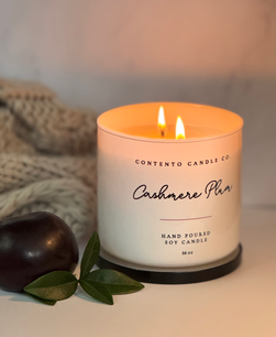 Contento Candle Co. handcrafted soy candles in elegant etched glass vessels, creating a warm and calming ambiance.