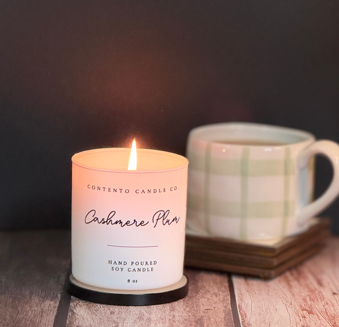 Contento Candle Co. handcrafted soy candles in elegant etched glass vessels, creating a warm and calming ambiance.