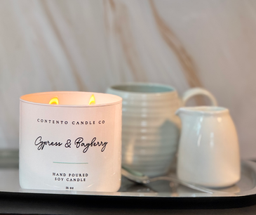 Contento Candle Co. handcrafted soy candles in elegant etched glass vessels, creating a warm and calming ambiance.