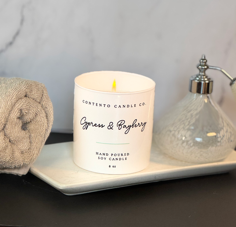 Contento Candle Co. handcrafted soy candles in elegant etched glass vessels, creating a warm and calming ambiance.