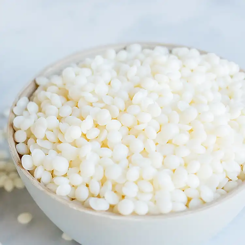 White wax pellets in bowl, CONTENTO CANDLE CO.
