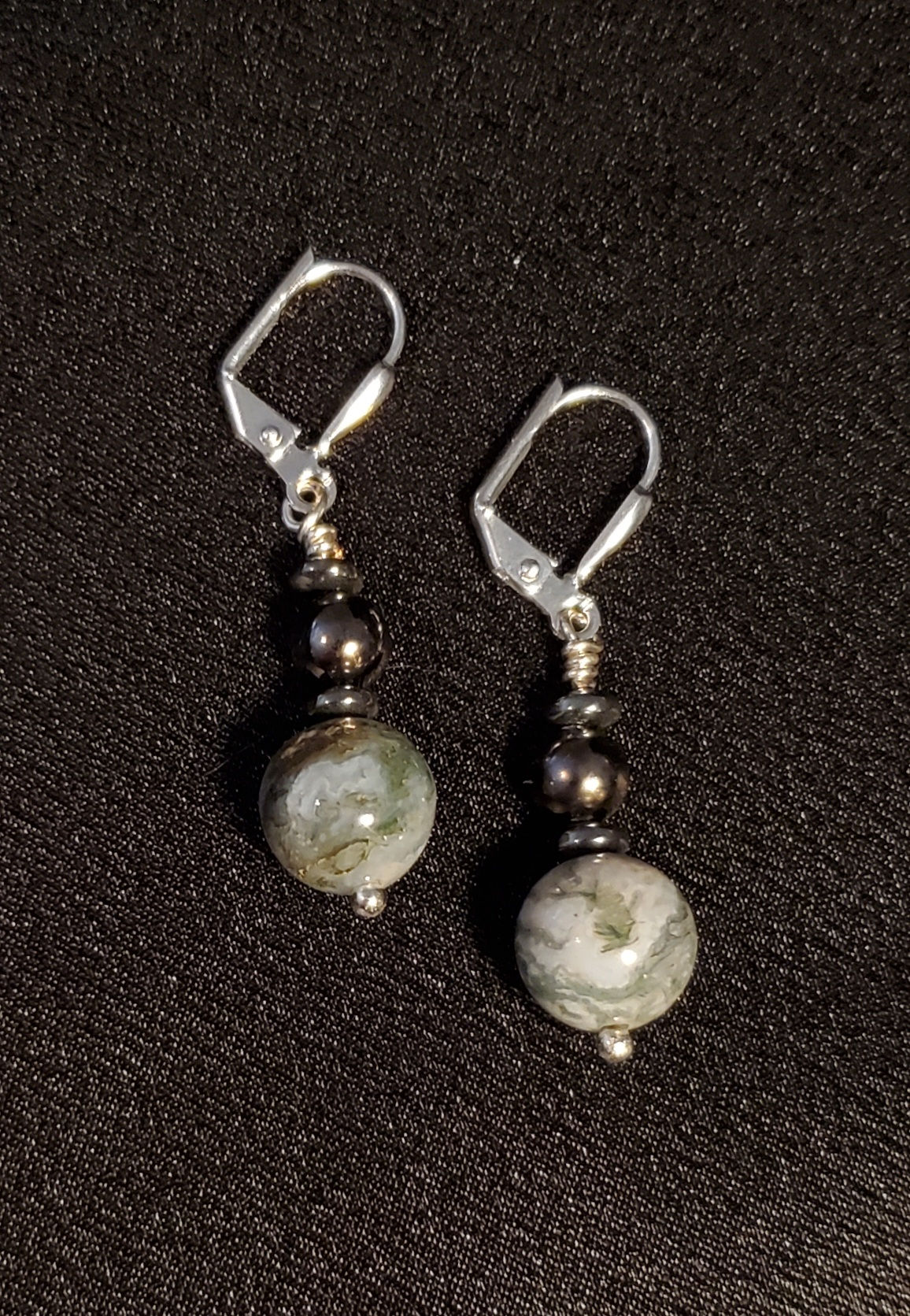 Green and white stone with hematite