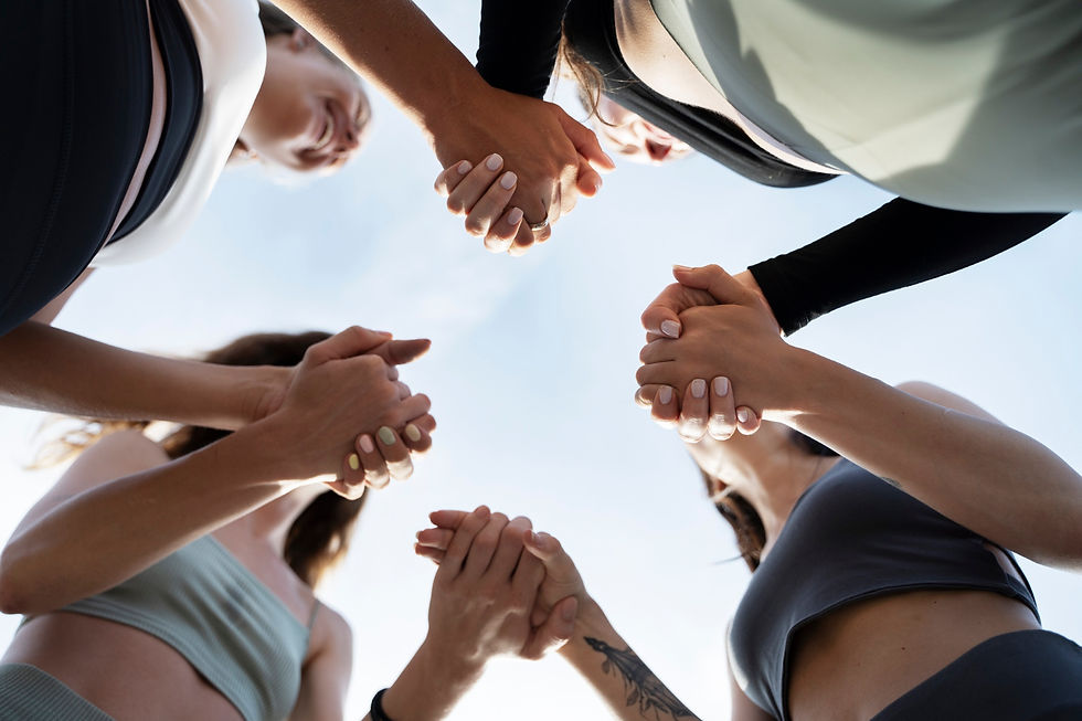 Women holding hands in a circle during a private wellness retreat in Costa Rica