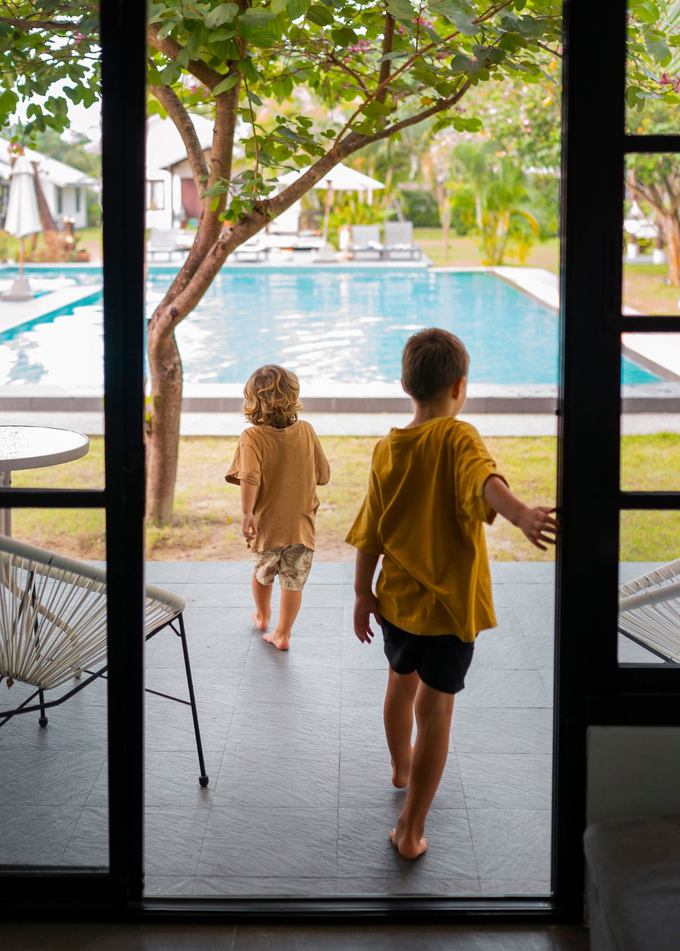 Kids heading out to the pool at a private villa during a family retreat in Costa Rica
