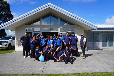 Group of secondary school students grouped together and smiling during Puatala HIIT90 Schoiol programme