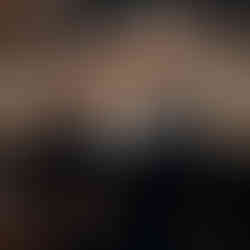 Artistic backlit wedding portrait of a couple kissing at Copenhagen City Hall.