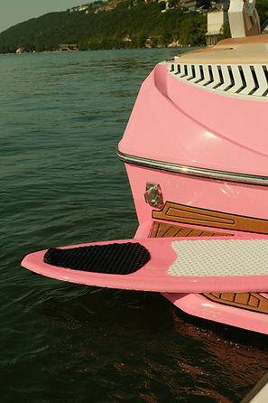 Pink Boat and Surf Board