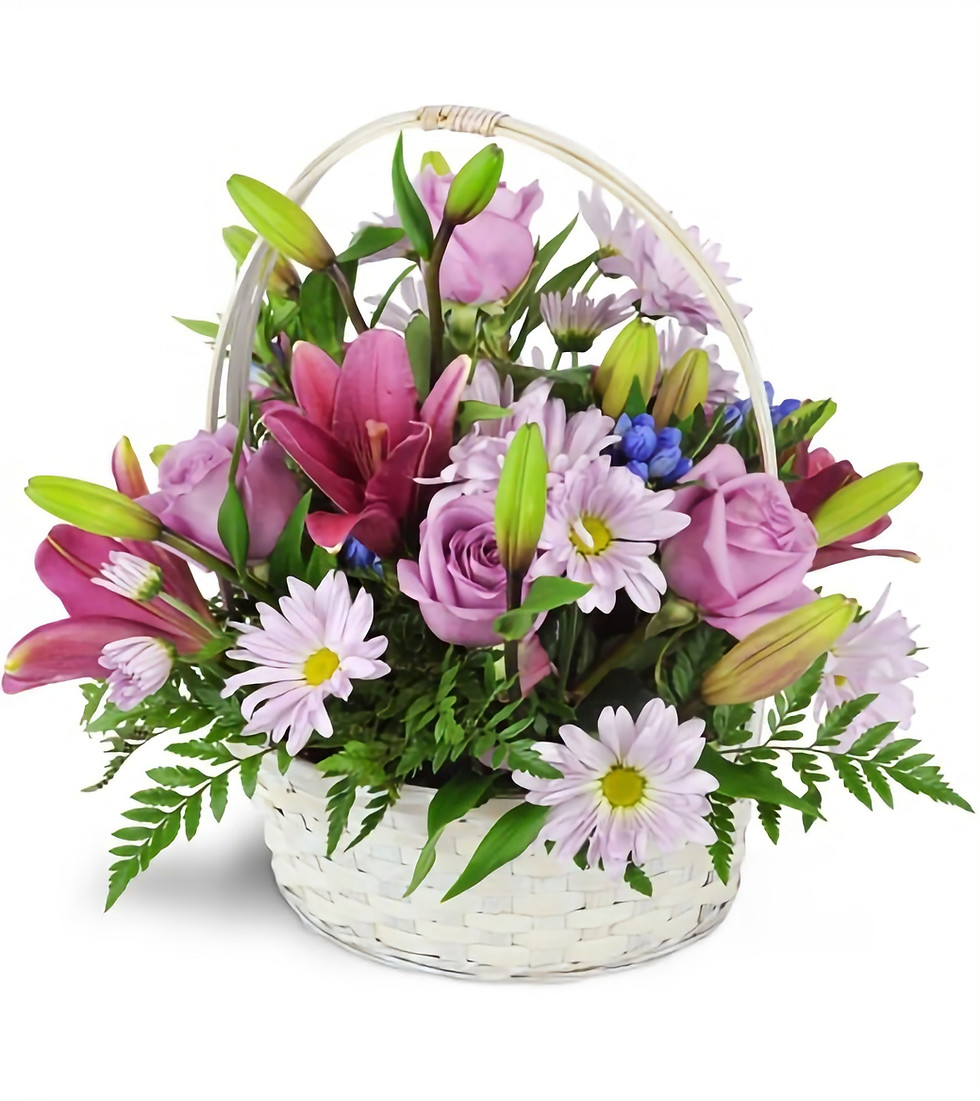 Spring Flowers In A Wicker Basket - From $60-$150 Spring flowers arranged in a wicker basket.