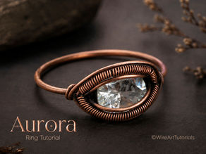 Aurora wire wrapped ring tutorial featuring an elegant copper wire ring with a sparkling marquise-cut crystal. This beginner-friendly jewelry making lesson teaches how to create a minimalist wire-wrapped ring using clean framing, decorative coiling, and a secure stone setting with step-by-step instructions.