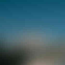 The exterior of the Hagia Sophia in Istanbul, with its central dome and four minarets under a blue sky