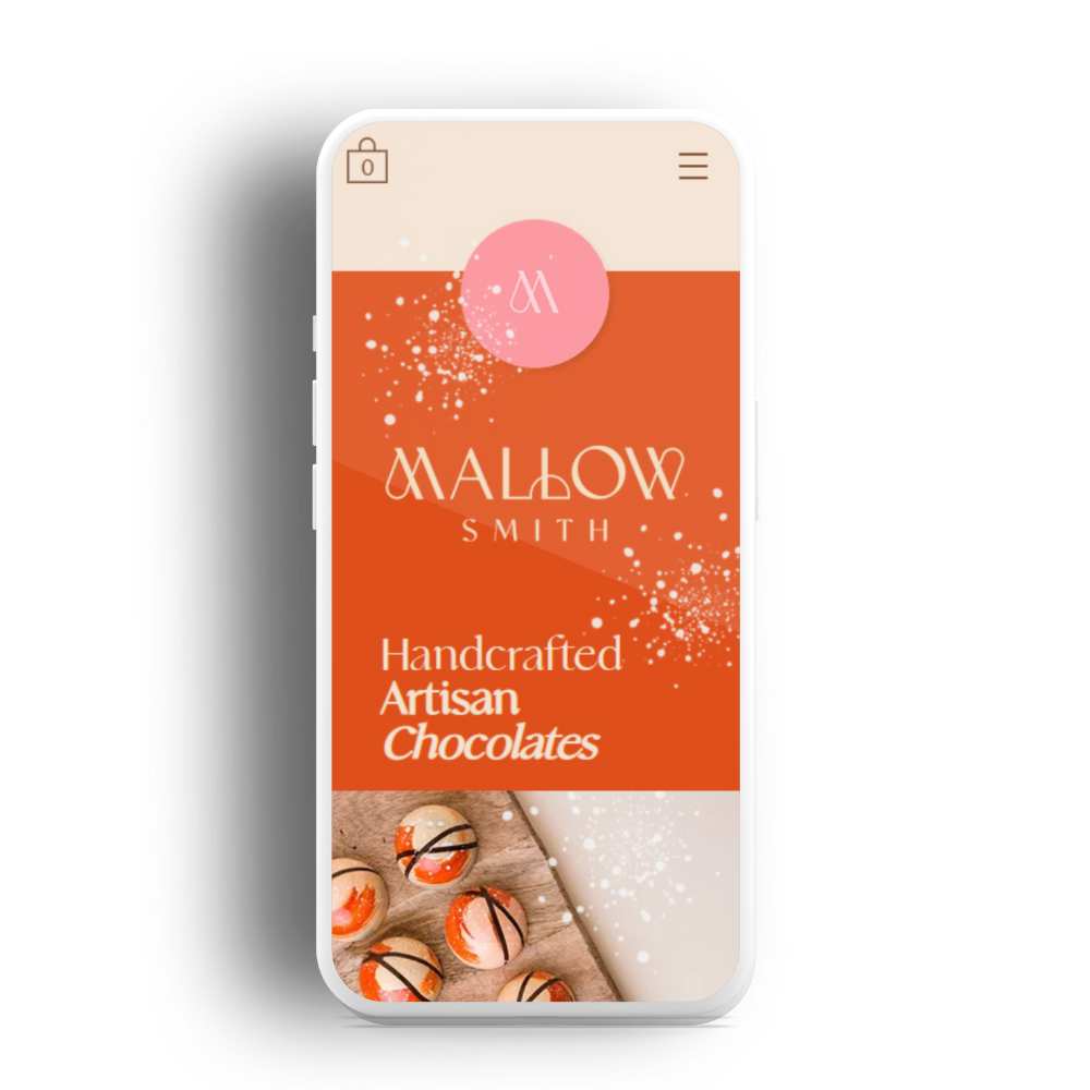 A smartphone displays the Mallow Smith SEO-optimised website with handcrafted artisan chocolates on an orange background.