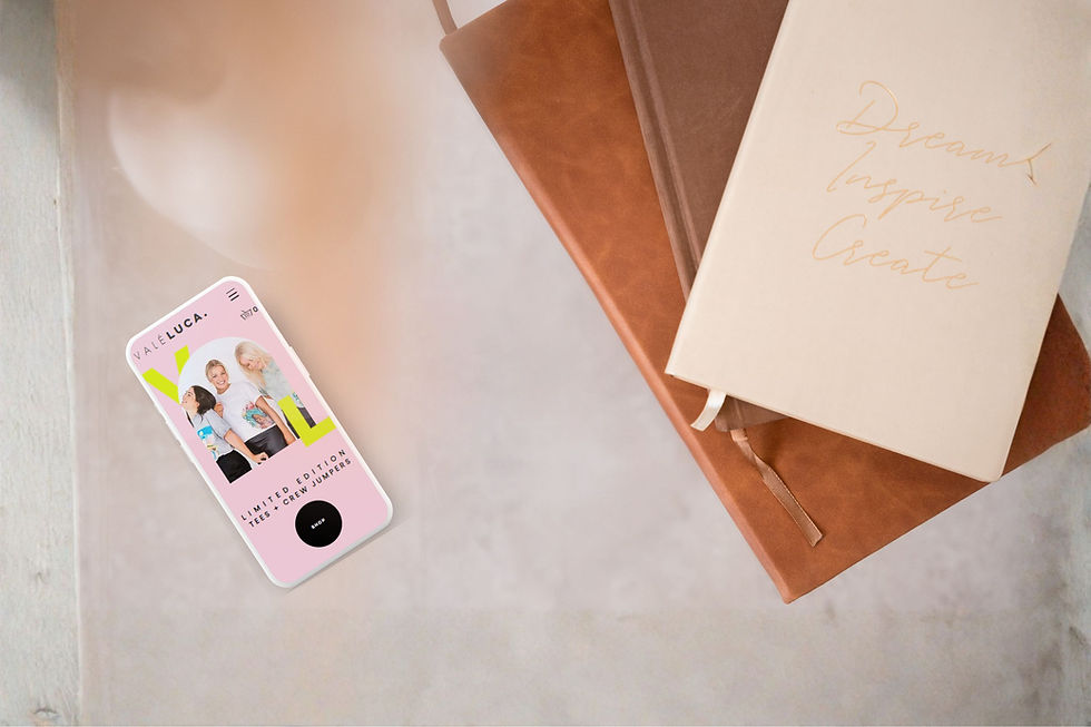 Pink phone with e-commerce site, 'Shop Now', and notebooks