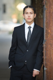 Senior male in suit by Evanton mural underpass — senior graduate photographer Evanston Chicago North Shore