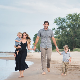 Family at mini session walking on the beach 
