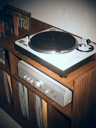 Close-up of turntable and silver amplifier on a walnut-finish Groove Wood Studio record player stand with front vinyl storage slots.
