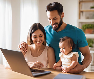 Parents typing a review while holding an infant.jpg