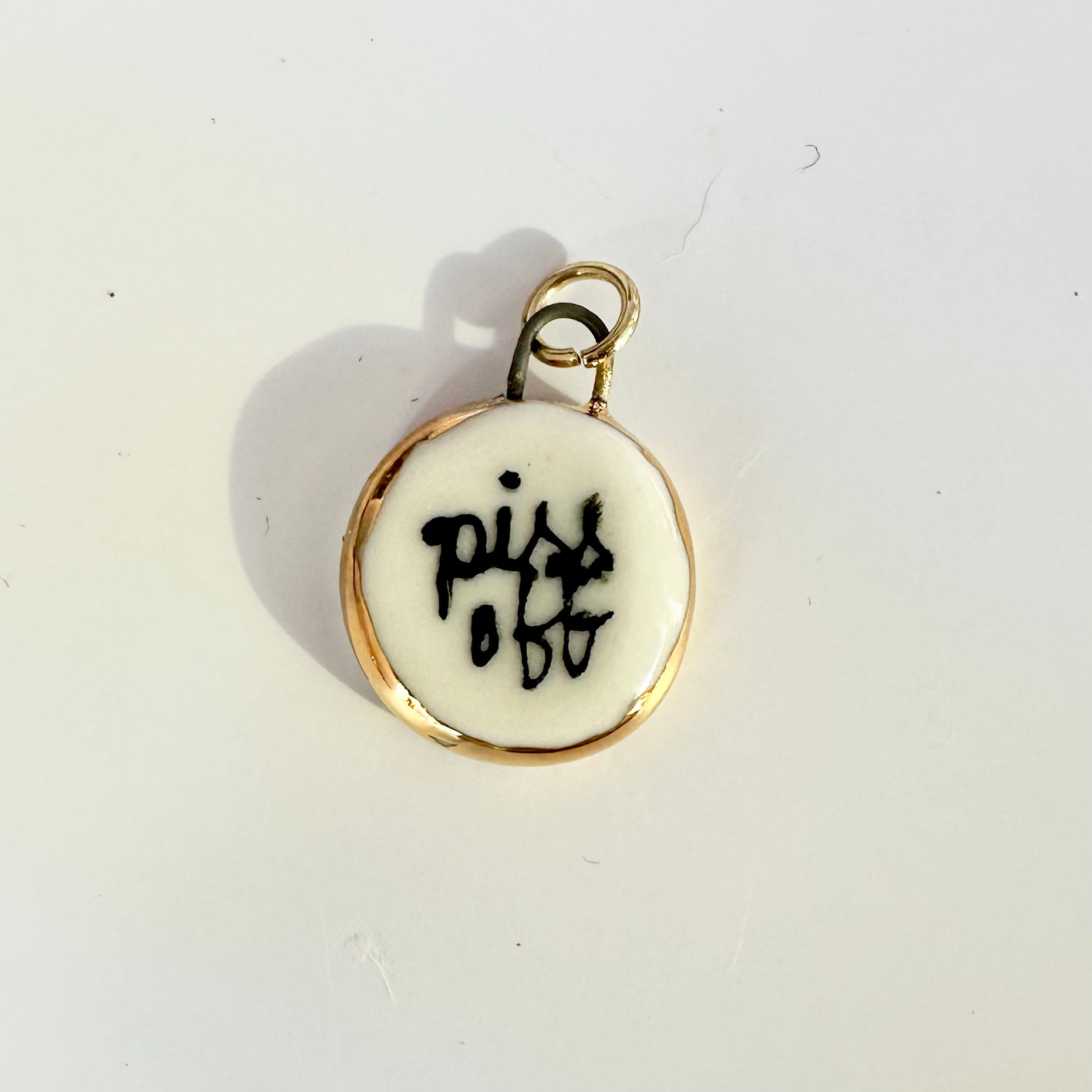 Piss off charm