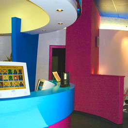 Bright colors, fun shapes and self-serve motivates kids to enter, enjoy or sit for homework until called into orthodontist space that also carries the same colorful motif.