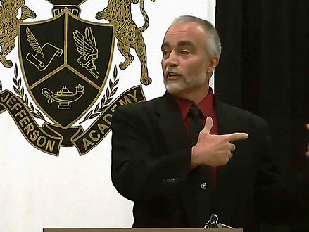 Scotte Burns speaks to a school group about love and learning.