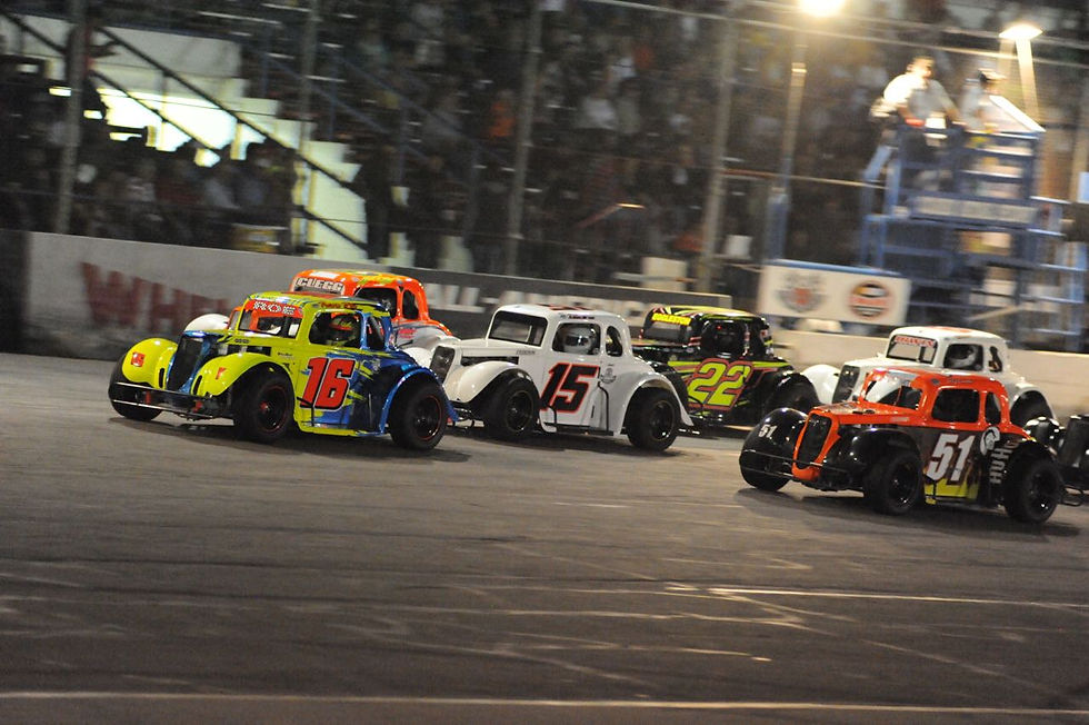 The Legends cars scramble at the drop of the green flag for their feature event (Starr photo)