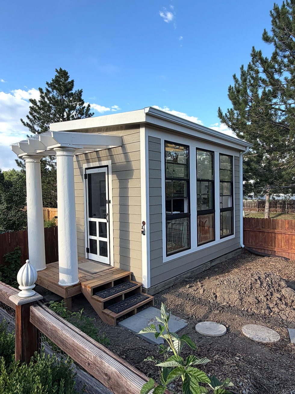 Completed Green House after installing a Deck, Pergola, Storm Door & Painting